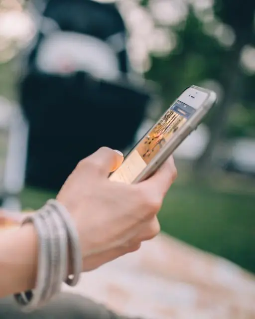 A hand holding a phone